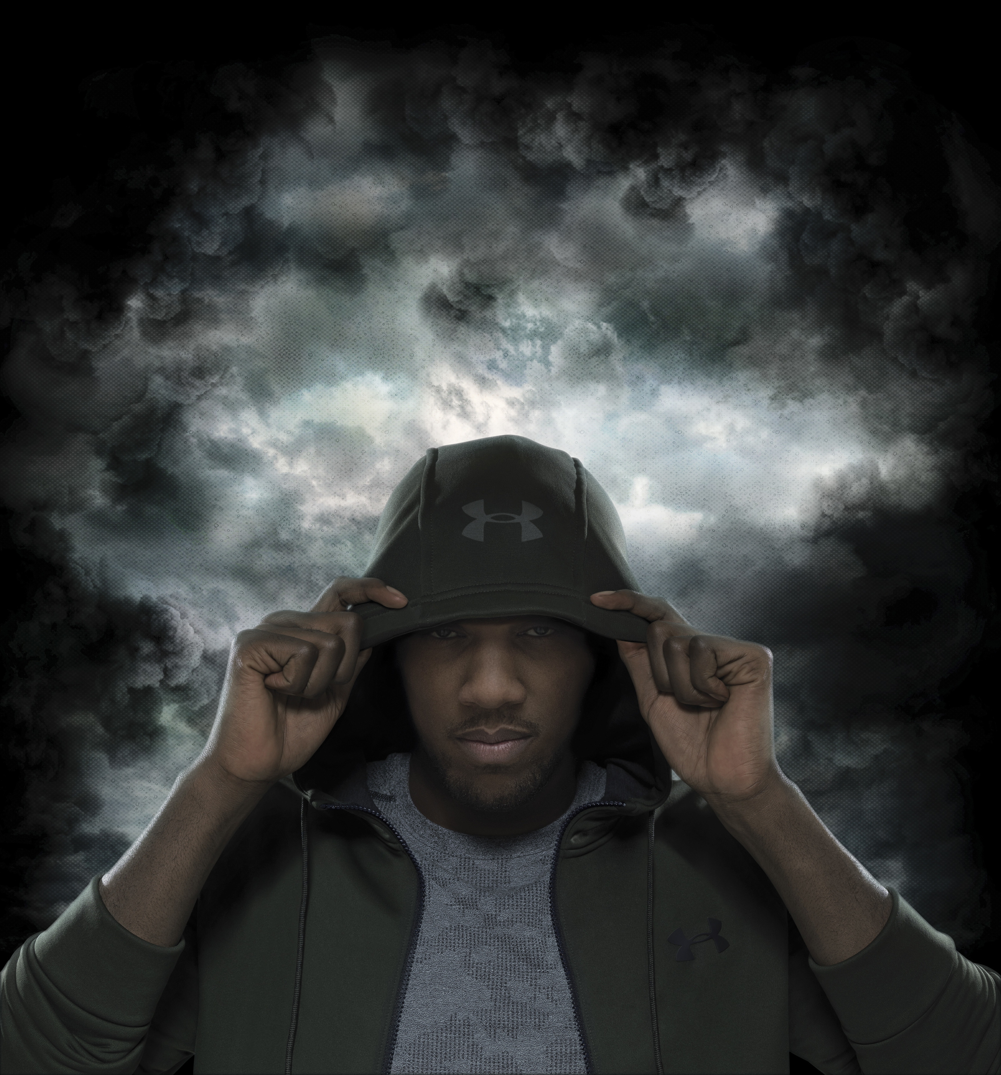 creative production featuring Anthony Joshua on a stormy background